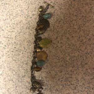 Thirteen charmed costume bronze bracelet.